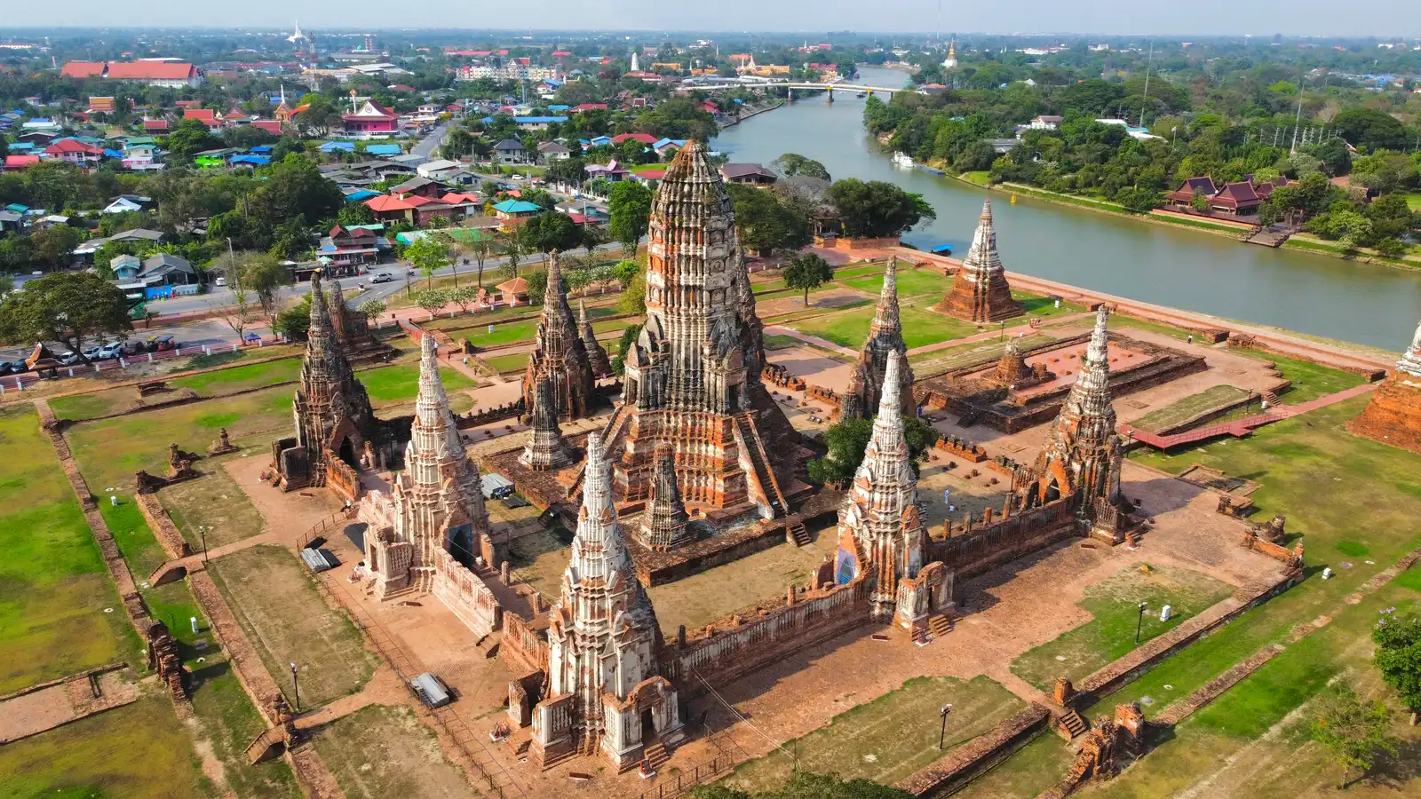 Riverside temple Wat Chaiwatthanaram glowing at dusk near the Ayutthaya private boat tour route